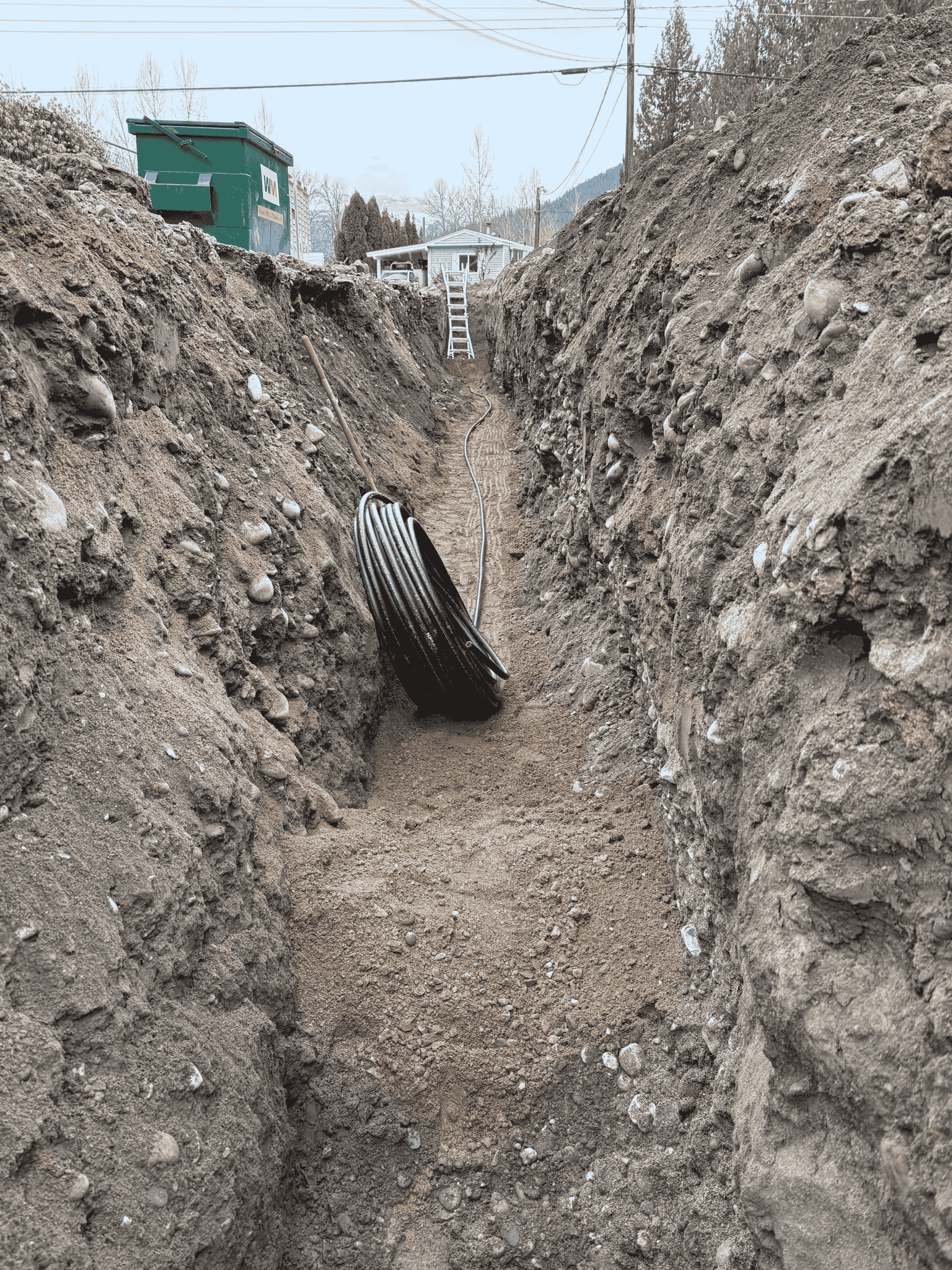 Plumbing trench with pipe